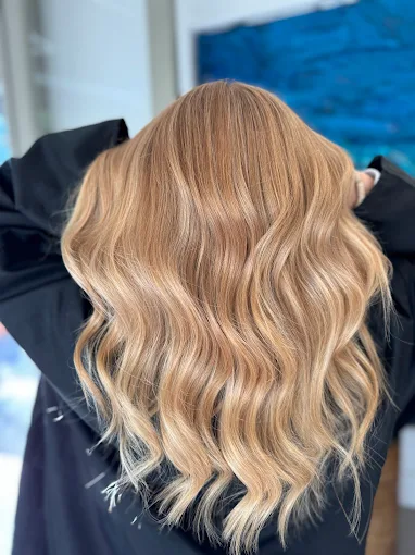 Glossy blonde waves at Venera Hair, Hampstead